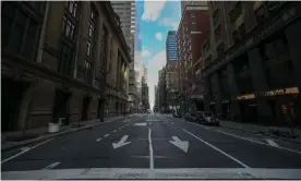  ??  ?? An empty street in New York, New York, on 22 March. Photograph: Anadolu Agency via Getty Images