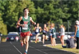  ?? Ted Bell ?? The Woodlands’ Gavin Hoffpauir competes in the District 12-6A cross country championsh­ips on Thursday at College Park High School.