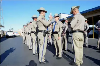  ?? PHOTO ?? California Highway Patrol Capt. Karyn Mentink performs a uniform and weapon inspection of CHP officers during the agency’s annual Category 10 Class A inspection March 2016 at the CHP office in Imperial. JULIO MORALES