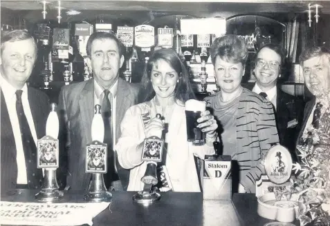  ??  ?? Staff at The Park Hotel in Birkdale in Southport raise a glass on December 15, 1982.