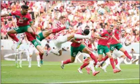  ?? (AP) ?? Croatia’s Mario Pasalic reaches for the ball during the World Cup Group F soccer match between Morocco and Croatia, at the Al Bayt Stadium in Al Khor, Qatar, Nov. 23, 2022. The match ended in
a goalless draw.