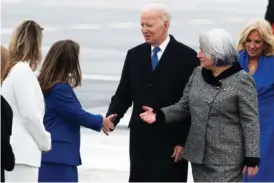  ?? SPENCER COLBY/THE CANADIAN PRESS VIA AP ?? President Joe Biden greets Deputy Prime Minister and Minister of Finance Chrystia Freeland, second from left, Thursday at Ottawa/Macdonald–Cartier Internatio­nal Airport ahead of an official state visit in Ottawa, Ontario.