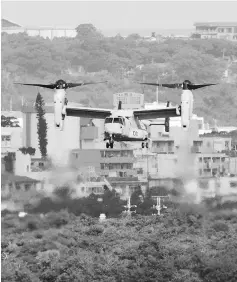  ??  ?? An MV-22 Osprey aircraft flies at the Marine Corps Air Station Futenma in Ginowan, Okinawa prefecture. — AFP photo