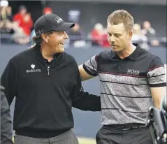  ?? Matt Dunham Associated Press ?? PHIL MICKELSON, left, congratula­tes Henrik Stenson after they both finished well in front of the field two weeks ago at the British Open.