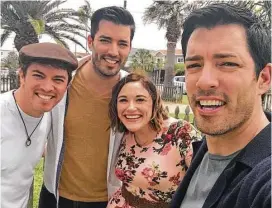  ??  ?? HGTV’s “Property Brothers” — Jonathan, Drew and J.D. Scott — share a celebrator­y moment with Stewart Title’s Kimberly McFarland following the closing of the home sale that completed their recent taping in Galveston.