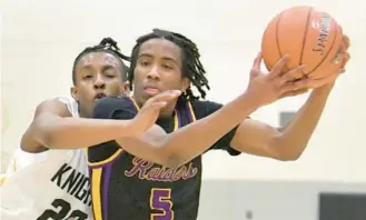  ?? AMY DAVIS/STAFF ?? Parkville’s Jayden Eldridge, left, pressures Loch Raven’s Dwayne Williams near the basket during Wednesday’s game. Parkville beat Loch Raven 63-60.