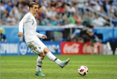  ?? ALEXANDER HASSENSTEI­N/GETTY IMAGES ?? France’s Antoine Griezmann (playing Friday against Uruguay) was a child when he received an autograph from French star Thierry Henry, who’s now a Belgium assistant coach.