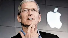  ?? RICHARD DREW/AP 2015 ?? CEO Tim Cook says the FBI wants Apple to build a “backdoor” to bypass digital locks.