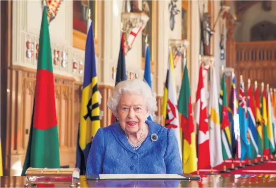  ?? GETTY IMAGES ?? Celebratio­n: The Queen signs her annual Commonweal­th Day Message at Windsor Castle