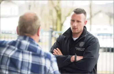  ?? H John Voorhees III / Hearst Connecticu­t Media ?? New Milford Community Care Coordinato­r Justin Cullmer talks with Bruce Kovacs on Friday.