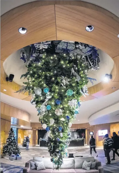  ?? CP PHOTO ?? An upside down Christmas tree is seen suspended from the ceiling at the Fairmont Vancouver Airport hotel in Richmond, B.C., on Monday