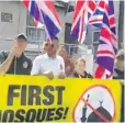  ??  ?? Images from Britain First’s Facebook video of Maidstone mosque protest and their leader Paul Golding, speaking to the camera and acknowledg­ing beeping cars