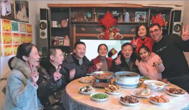  ??  ?? Above: Ghamgeen Izat Rashed, right, an Iraqi university teacher in Wuhan, poses with his wife’s family at a Spring Festival family gathering in the city.