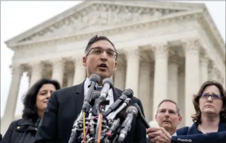  ?? ANDREW HARNIK — THE ASSOCIATED PRESS ?? Neal Katyal, the attorney who argued against the Trump administra­tion in the case Trump v. Hawaii, speaks to members of the media outside the Supreme Court, Wednesday in Washington. President Donald Trump appears likely to win his travel ban case at...