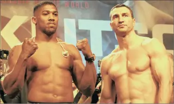  ??  ?? BATTLE OF EXTREMES: Anthony Joshua, left, and Wladimir Klitschko at yesterday’s weigh-in for their world heavyweigh­t title showdown. They will battle it out for Joshua’s IBF heavyweigh­t championsh­ip belt and the vacant WBA title in front of 90 000...