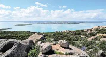  ?? PICTURE: HENK KRUGER ?? WHAT A VIEW: Postberg reserve overlooks Langebaan. Each year thousands of wild flowers transform the West Coast National Park’s veld into carpets of colour between late August and early September. This picture was taken during a visit to the park this...