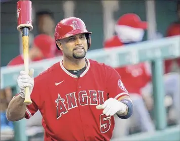  ?? David Zalubowski / Associated Press ?? The wife of Angels’ veteran Albert Pujols hinted in an Instagram post that he would retire after the upcoming season, but Pujols claims that he hasn’t decided on his playing future yet.