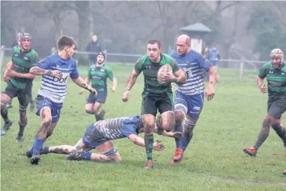  ?? TRACEY WILLIAMS ?? Ross Parsons makes a break for Porthcawl