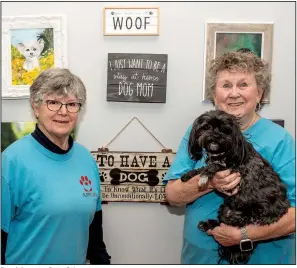  ?? (Arkansas Democrat-Gazette/Cary Jenkins) ?? Proud dog mom Patty Snipes (right) visits area nursing homes and assisted care facilities with her dog Molly as part of the Puppy Love program. Dee Sadler (left) began the program in 2014.