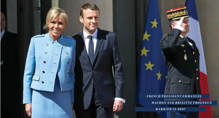  ?? PHOTO: QUENTIN VEUILLET/AAP ?? French President Emmanuel Macron poses with his wife Brigitte Trogneux on the pediment of the Elysee presidenti­al Palace in Paris after the handover and inaugurati­on on May 14. FRENCH PRESIDENT EMMANUEL MACRON AND BRIGITTE TROGNEUX MARRIED IN 2007