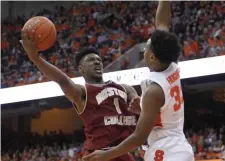  ?? ASSOCIATED PRESS ?? ROAD BLOCK: Boston College's Jarius Hamilton tries to shoot against Syracuse's Elijah Hughes yesterday.