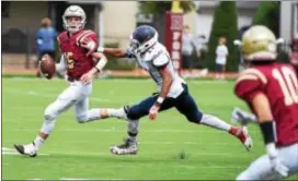  ?? PETE BANNAN — DIGITAL FIRST MEDIA ?? Haverford School quarterbac­k Tommy Toal, left, threw for 229 yards and four touchdowns in a wild second quarter that paved the way for the Fords’ 48-28 romp past Penn Wood.