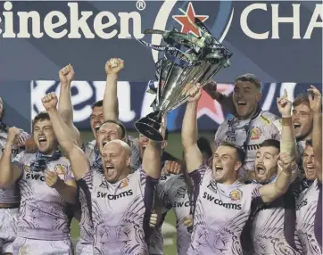  ??  ?? 0 Exeter Chiefs captains Jack Yeandle and Joe Simmonds, raise the trophy as they celebrate.