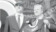  ?? Jon Durr / Getty Images ?? California quarterbac­k Jared Goff is all smiles with NFL commission­er Roger Goodell after the Los Angeles Rams made him the No. 1 overall pick.