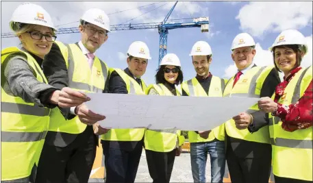  ?? Photo by John Reidy ?? Plans to Open: Members of the Windmill Group and site management personnel pictured at the unfolding developmen­t of the Castleisla­nd Nursing Home Project. Included are from left: Karen Butler and Pat Kennedy, Windmil Group; Rory McGillycud­dy, Rory McGillycud­dy & Associates Design, Engineerin­g & Project Management Consultanc­y; Frances Neilan, Windmill Group; Jim McAuliffe, Griffin Bros, Builders Site Foreman; Denis McElligott and Evie Hallissey, Windmill Group.