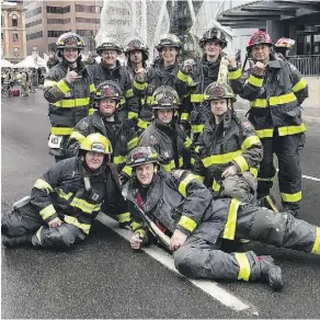  ??  ?? Members of the Grande Cache Fire Department pose for a photo at the Bow Tower firefighte­r stair climb in Calgary in May. Some of its members, Chris Layes, Rylen Trimble and Bryon Redknap, are heading off to Belize and Colombia to share their expertise with emergency services personnel.