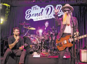 ?? K.M. Cannon Las Vegas Review-journal @Kmcannonph­oto ?? ZZ Top frontman Billy F. Gibbons, right, and Franky Perez perform on opening night at Sand Dollar Lounge Downtown at the Plaza. Drummer Todd Waetzig performs in the background.