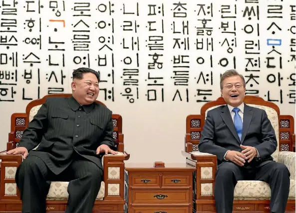  ??  ?? North Korean leader Kim Jong-un, left, and South Korean President Moon Jae-in pose for photos during their summit in Panmunjom, South Korea. They repeated past vows to remove nuclear weapons from the Korean Peninsula, but failed to outline any new...
