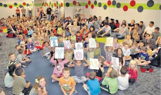  ?? [PHOTO PROVIDED] ?? Prekinderg­arten students at Mustang Education Center, along with the district’s alternativ­e education students, pose for a photo during a tornado drill in the school’s new storm shelter. The shelter was made possible by a 2014 bond issue.