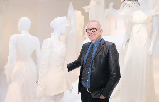  ?? PHOTOS: CHRISTINNE MUSCHI ?? Designer Jean Paul Gaultier poses in front of his wedding-themed exhibition Love is Love at the Montreal Museum of Fine Arts.
