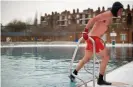  ??  ?? A swimmer braves the cold at Parliament Hill lido in mid-winter. Photograph: Leon Neal/AFP/Getty Images