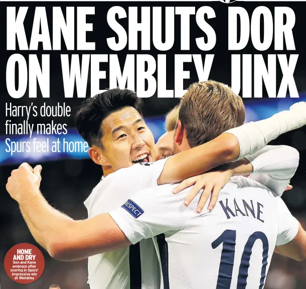  ??  ?? HOME AND DRY Son and Kane embrace after scoring in Spurs’ impressive win at Wembley