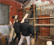  ??  ?? LEFT: Cllr John Snell inside the shell of the building in September 2016. ABOVE: Cllr Snell, Sean O’Toole and Billy Russel working on the building in December 2016.