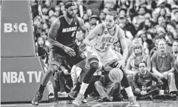  ?? ROB GRABOWSKI, USA TODAY SPORTS ?? Joakim Noah, right, says LeBron James and the Heat stand in the Bulls’ path to a championsh­ip.