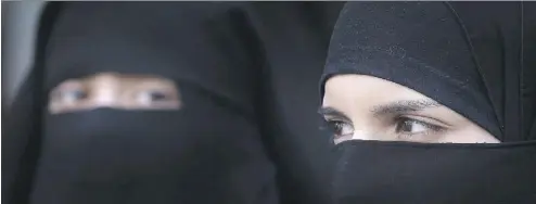  ?? PETER MACDIARMID/GETTY IMAGES/FILES ?? Quebec’s ban on face coverings like these niqab veils, which was passed with the intent of defending “religious neutrality,” would instead restrict religious freedom, and drive those who wear them further from public life.