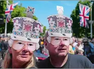  ?? FRANK AUGSTEIN/AP PHOTO ?? Royal fans gather Saturday on the Mall near Buckingham Palace, London ahead of the Platinum Jubilee concert, on the third of four days of celebratio­ns to mark the Platinum Jubilee.