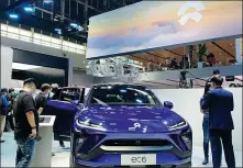  ?? ZHANG DANDAN / CHINA DAILY ?? From top: Chinese NEV startup Nio shows its ec6 model at the 2020 Beijing auto show.