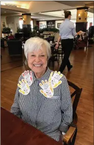  ??  ?? Heritage of Green Hills resident Audrey Sterkin wears some “hugs, COVID-style” given to her by other residents to celebrate World Kindness Day.