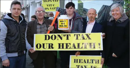  ??  ?? Tamas Giran, David Kidd, Patrick Devereux, Matt Ronan and Nuala Ronan at the Health Food Tax protest at Evolv, Castle Hill on Friday.