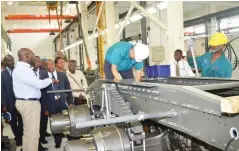  ??  ?? Project Manager, Dangote Group, Tijani Momodu explaining some points, when he conducted Journalist­s round Dangote Sinotruck assembly plant, at Oba Akran in Lagos.