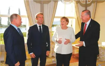  ?? AP ?? From left: Russia’s President Vladimir Putin, France’s President Emmanuel Macron, German Chancellor Angela Merkel and Turkey’s president Recep Tayyip Erdogan before the summit.