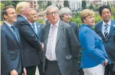  ??  ?? Left: Emmanuel Macron, Donald Trump, Donald Tusk, Jean-claude Juncker, Theresa May, Angela Merkel and Shinzo Abe at the G7 summit in Taormina, Sicily