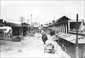  ?? Photograph­s from Security Pacific National Bank Collection ?? A STREET in the Chinese Quarter of Los Angeles in 1885. On Oct. 24, 1871, a racist mob killed 19 Chinese people, including a 14-year-old and a physician. The mob then stole an estimated $40,000 in cash, gold and jewels.