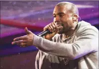  ??  ?? Kanye West performs during the World AIDS Day (RED) concert In Times Square in 2014. Not everyone is pleased by the announceme­nt that American rap legend Kanye West will perform at the closing ceremony of the Pan Am Games in Toronto. An online petition...