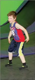  ?? MICHILEA PATTERSON — DIGITAL FIRST MEDIA ?? Grady Scholla, 6, jumps on a trampoline while playing dodgeball with friends at the Get Air Trampoline Park in King of Prussia on Wednesday.