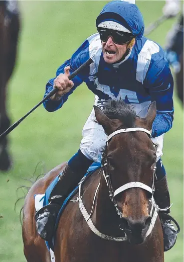  ?? Picture: AAP ?? ROLE MODEL: Hugh Bowman rides Winx to victory in the Cox Plate at Moonee Valley.